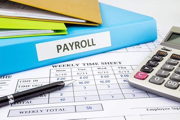 PAYROLL-word-on-blue-binder-place-on-weekly-time-sheet-and-payroll-summary-report,-human-resources-concept